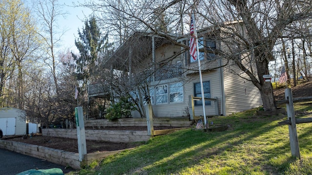 3193 Pine Ridge Dr, Bushkill, PA 18324 - view of property exterior with a yard, a storage unit, and an outbuilding
