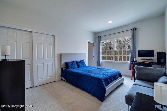 bedroom featuring a closet, recessed lighting, carpet flooring, and baseboards