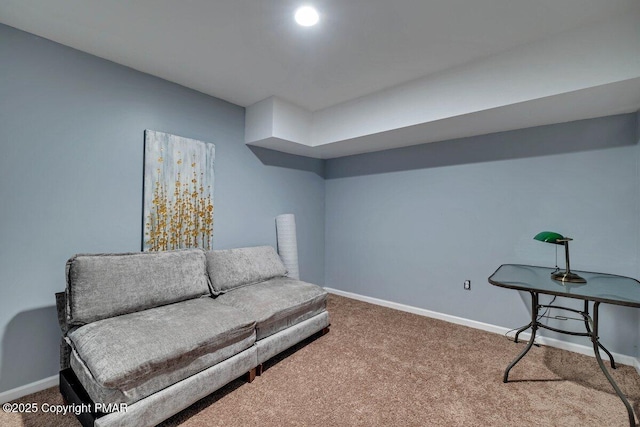 living area with carpet and baseboards