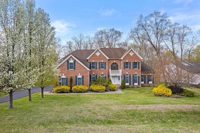 255 Rising Meadow Way E, Stroudsburg, PA 18302 - colonial home featuring brick siding and a front lawn