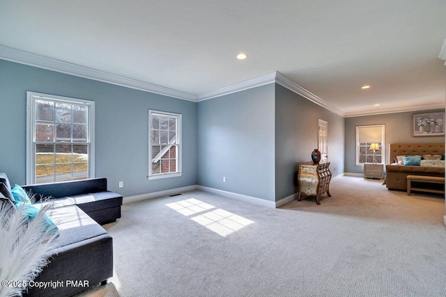 living room with carpet floors, a healthy amount of sunlight, and baseboards