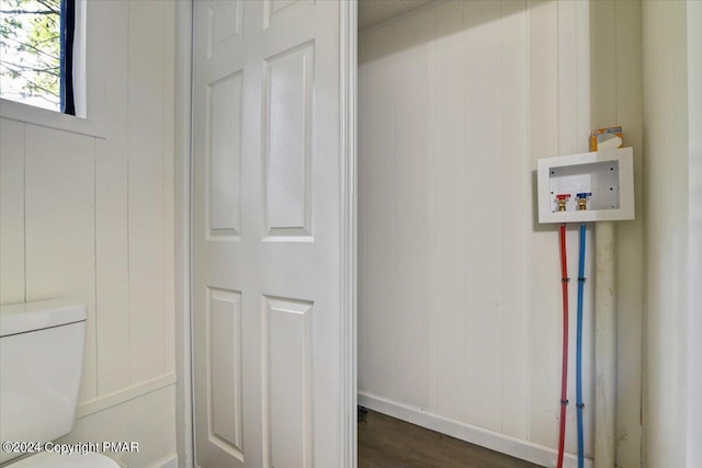 laundry room with dark wood-type flooring, washer hookup, and laundry area