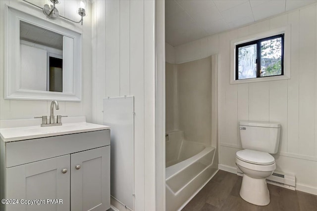 full bathroom with a baseboard radiator, shower / bathing tub combination, toilet, vanity, and wood finished floors