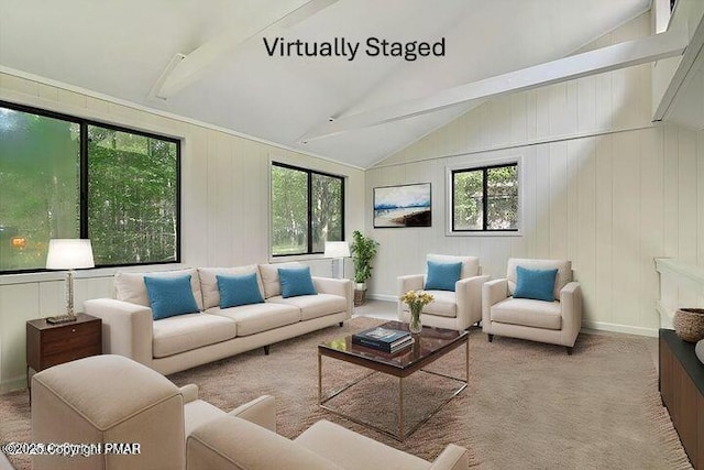 living area with vaulted ceiling and baseboards