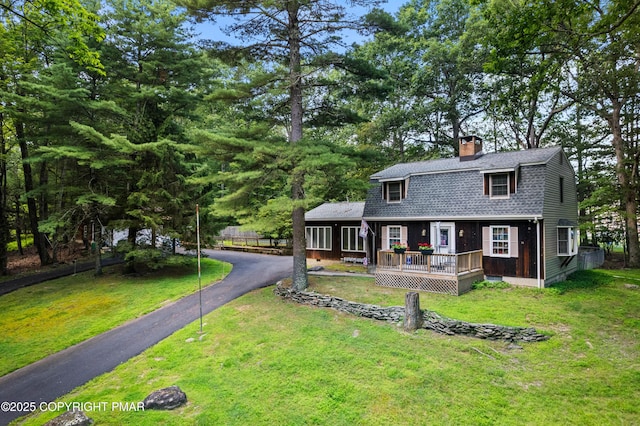 4462 Woodside Dr, East Stroudsburg, PA 18301 - dutch colonial with a chimney, a shingled roof, asphalt driveway, a front yard, and a gambrel roof