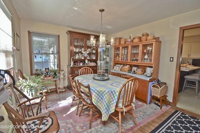 4462 Woodside Dr, East Stroudsburg, PA 18301 - dining area featuring a chandelier and light wood-style flooring