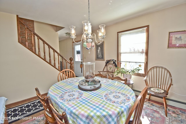 4462 Woodside Dr, East Stroudsburg, PA 18301 - dining area featuring stairway, a chandelier, and wood finished floors