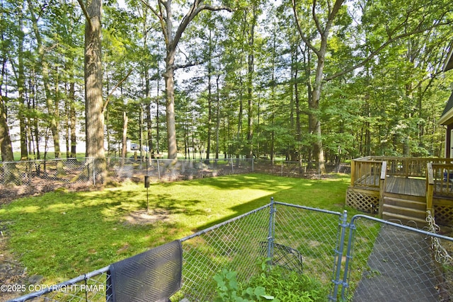 4462 Woodside Dr, East Stroudsburg, PA 18301 - fenced backyard with a gate and a deck