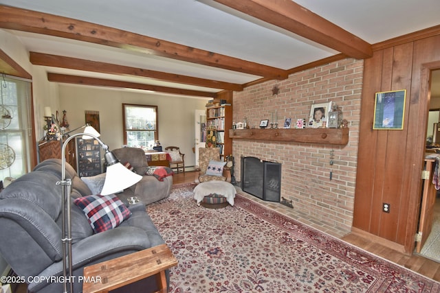 4462 Woodside Dr, East Stroudsburg, PA 18301 - living area with wood finished floors, beam ceiling, a fireplace, wooden walls, and a baseboard radiator