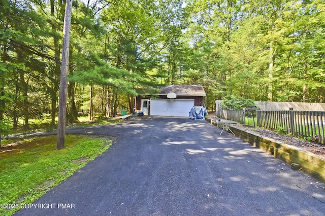 4462 Woodside Dr, East Stroudsburg, PA 18301 - view of front of house with an outdoor structure, a garage, and driveway