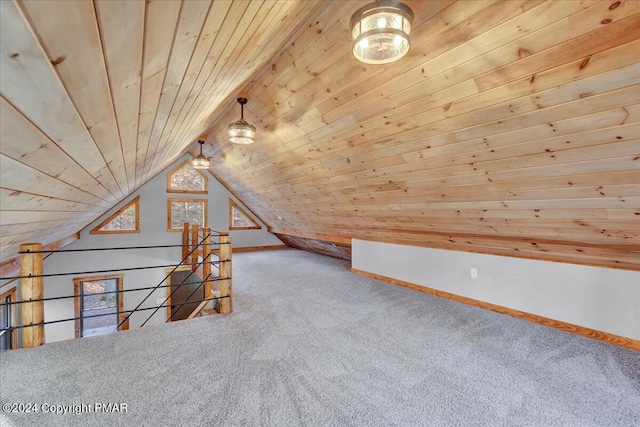 additional living space featuring lofted ceiling, carpet floors, wood ceiling, and baseboards