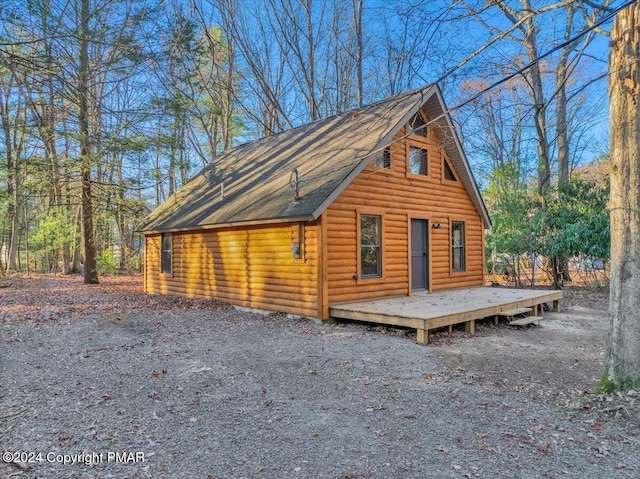 view of home's exterior featuring an outbuilding