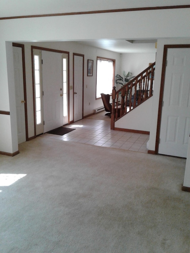 2852 Oak View Ln, Tobyhanna, PA 18466 - carpeted entrance foyer with a baseboard radiator, tile patterned flooring, and stairs