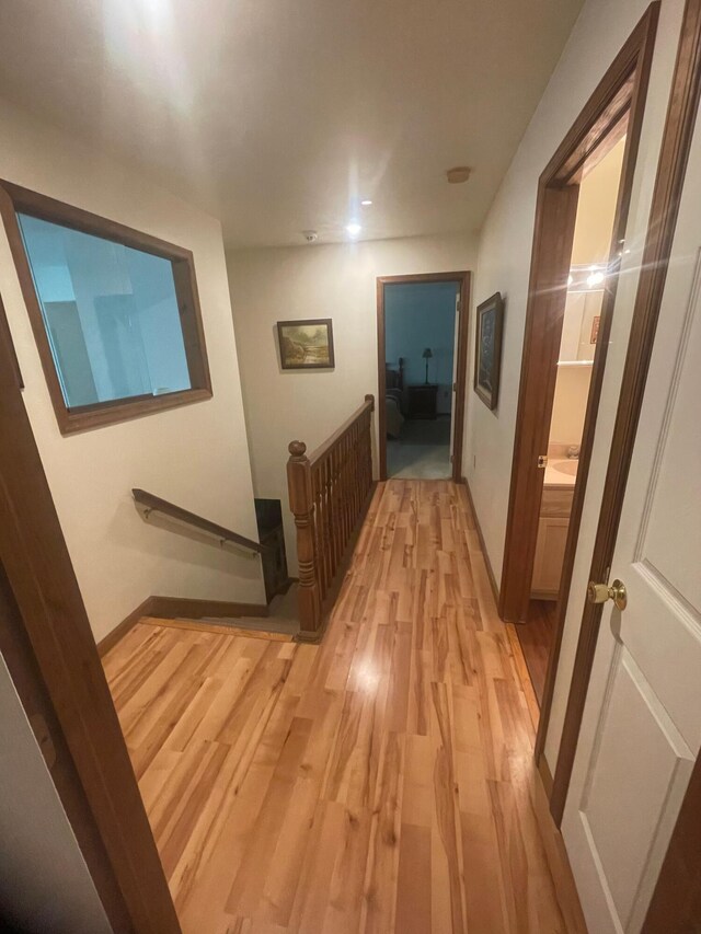 2852 Oak View Ln, Tobyhanna, PA 18466 - corridor featuring light wood-style flooring and an upstairs landing