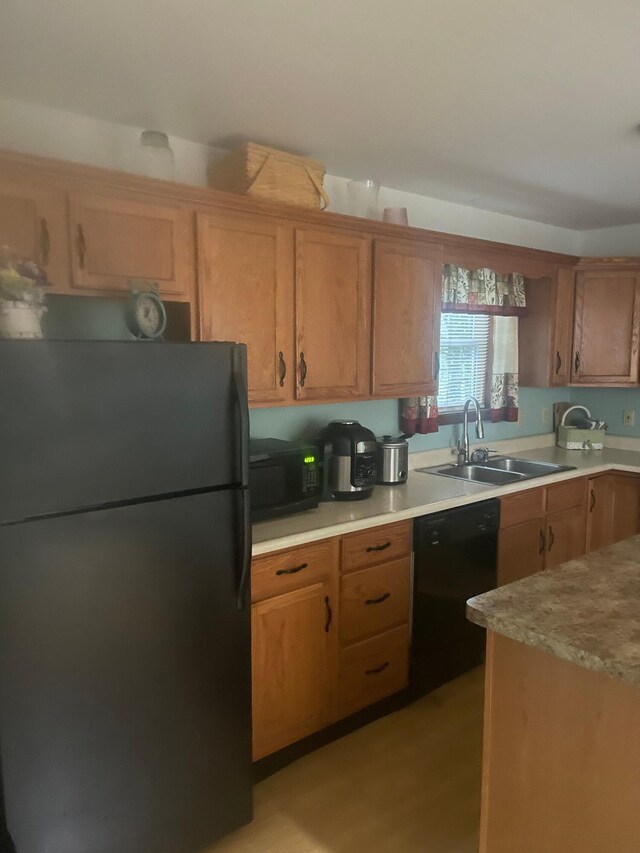 2852 Oak View Ln, Tobyhanna, PA 18466 - kitchen featuring black appliances, light countertops, and brown cabinetry