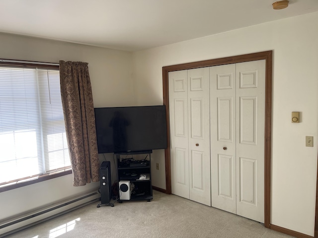 2852 Oak View Ln, Tobyhanna, PA 18466 - bedroom featuring a baseboard radiator, light colored carpet, and a closet