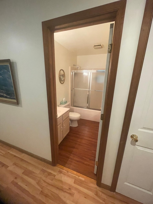 2852 Oak View Ln, Tobyhanna, PA 18466 - bathroom featuring wood finished floors, vanity, and enclosed tub / shower combo