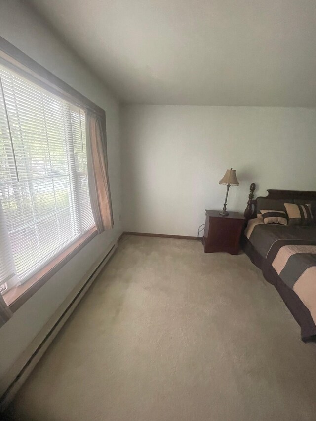 2852 Oak View Ln, Tobyhanna, PA 18466 - bedroom featuring a baseboard heating unit and light carpet