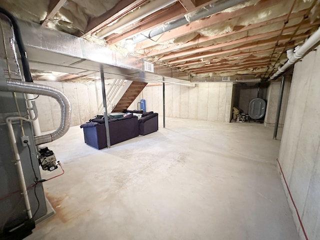 unfinished basement featuring heating fuel