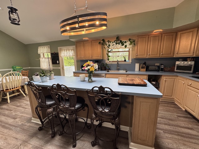462 Plane St, Weatherly, PA 18255 - kitchen with a sink, vaulted ceiling, a kitchen island, dark wood-style flooring, and a breakfast bar
