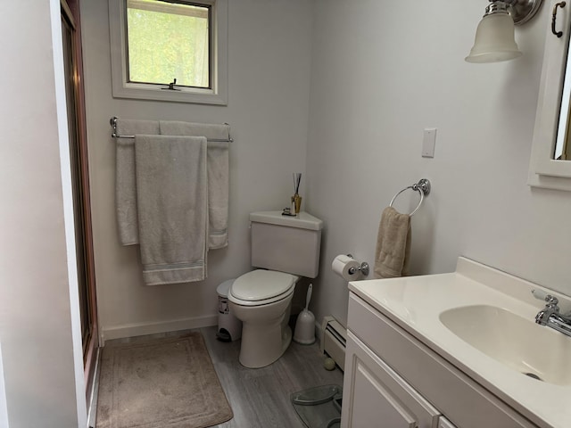 462 Plane St, Weatherly, PA 18255 - bathroom with a baseboard radiator, vanity, toilet, an enclosed shower, and wood finished floors