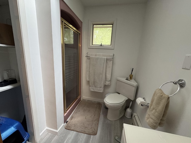 462 Plane St, Weatherly, PA 18255 - full bathroom with a stall shower, wood finished floors, toilet, a baseboard radiator, and baseboards