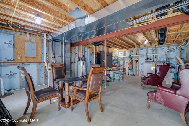 unfinished basement featuring electric panel and water heater