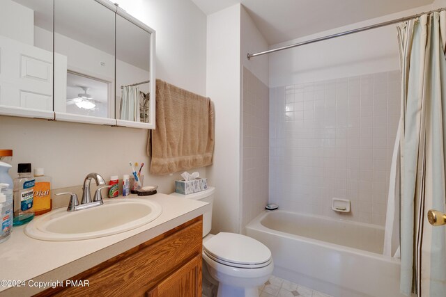 bathroom featuring toilet, shower / tub combo, a ceiling fan, and vanity