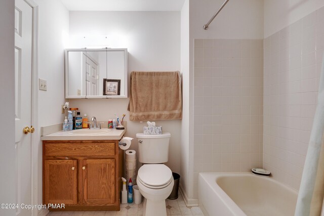 bathroom featuring shower / washtub combination, vanity, and toilet