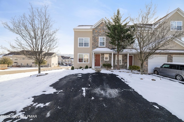 view of front of house with stone siding and an attached garage