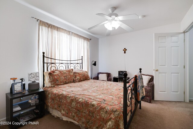 bedroom featuring ceiling fan and carpet flooring