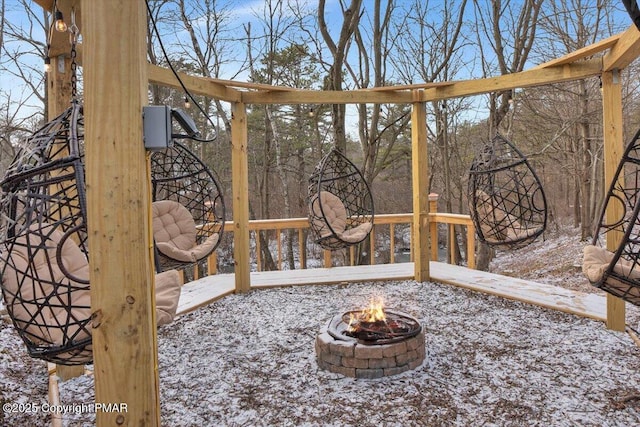 exterior space featuring an outdoor fire pit