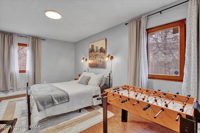 bedroom with hardwood / wood-style floors