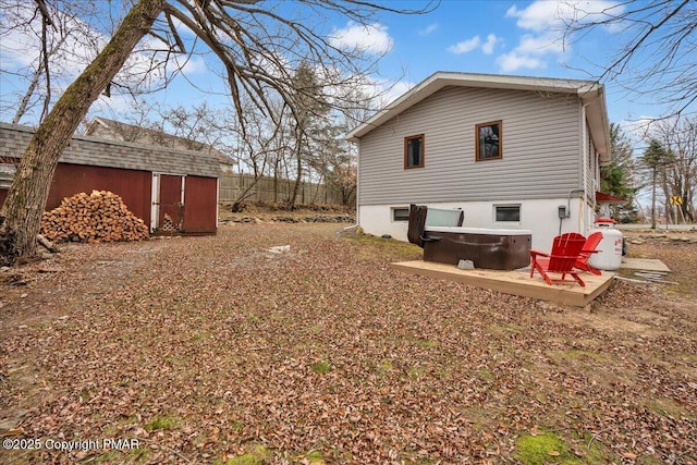 view of home's exterior with an outbuilding and a storage shed