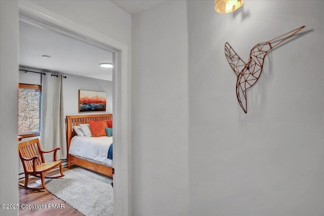 bedroom with wood finished floors