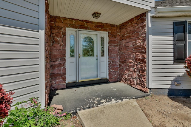 entrance to property with brick siding