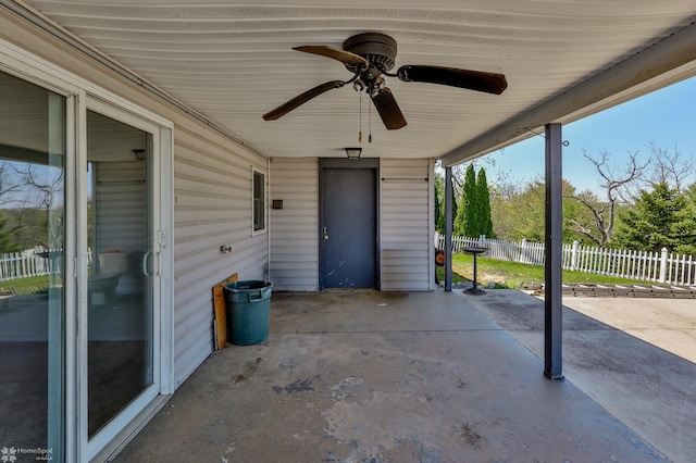 view of patio featuring fence and ceiling fan