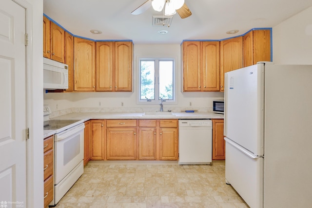 kitchen featuring ceiling fan, a sink, white appliances, light countertops, and visible vents