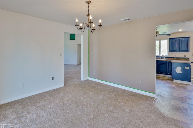 unfurnished dining area featuring baseboards, visible vents, light colored carpet, and a chandelier