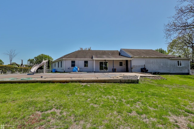 back of property featuring a lawn and a patio area