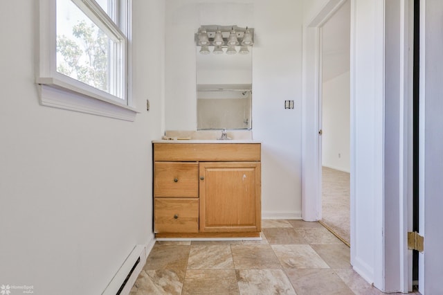 bathroom featuring baseboards and vanity