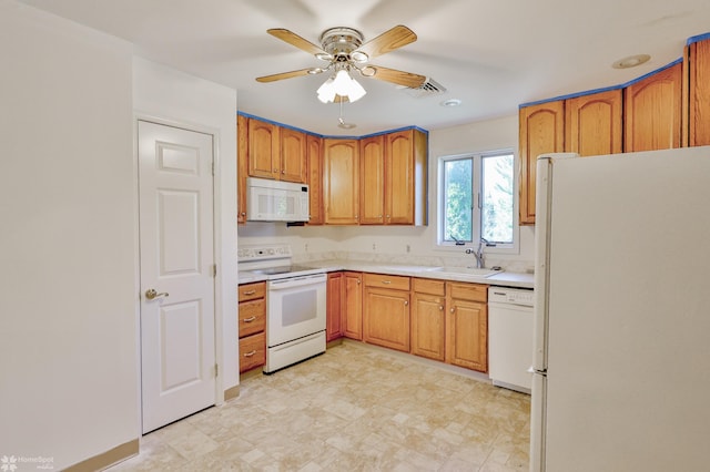 kitchen with ceiling fan, a sink, white appliances, light countertops, and visible vents