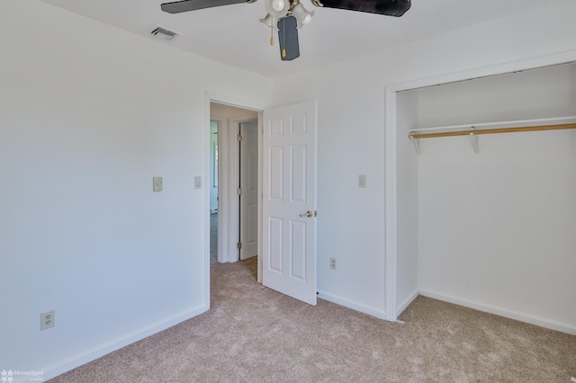 unfurnished bedroom featuring visible vents, a ceiling fan, a closet, baseboards, and carpet flooring