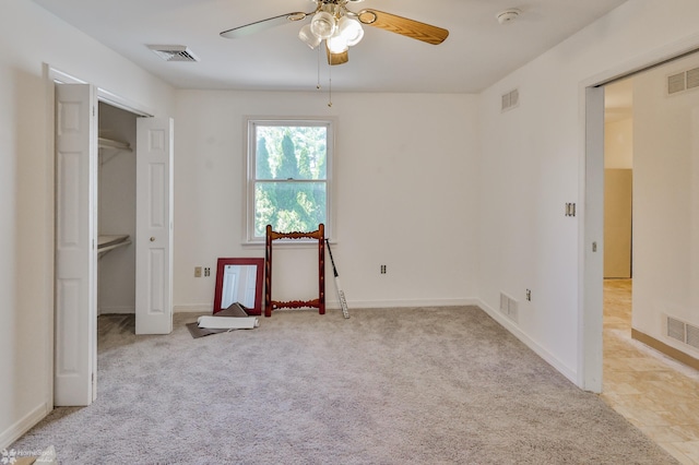 unfurnished bedroom with light colored carpet and visible vents