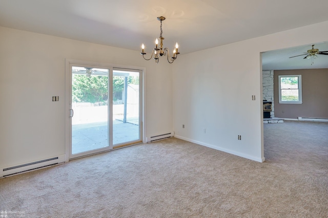 unfurnished room with carpet flooring and a baseboard heating unit