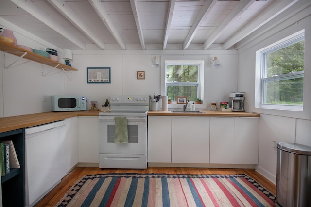 235 3rd St, Pocono Pines, PA 18350 - kitchen with white appliances, butcher block countertops, beam ceiling, open shelves, and healthy amount of natural light