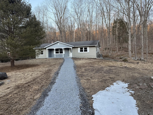 view of front of property with driveway and a porch