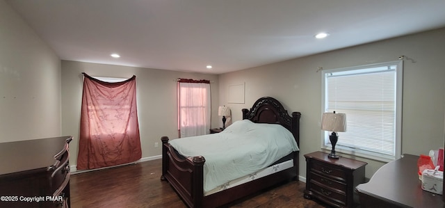 bedroom with dark wood finished floors, recessed lighting, and baseboards