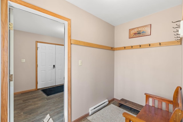 interior space with wood finished floors, baseboards, and a baseboard radiator