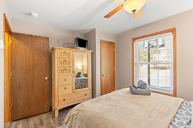 bedroom featuring ceiling fan and wood finished floors